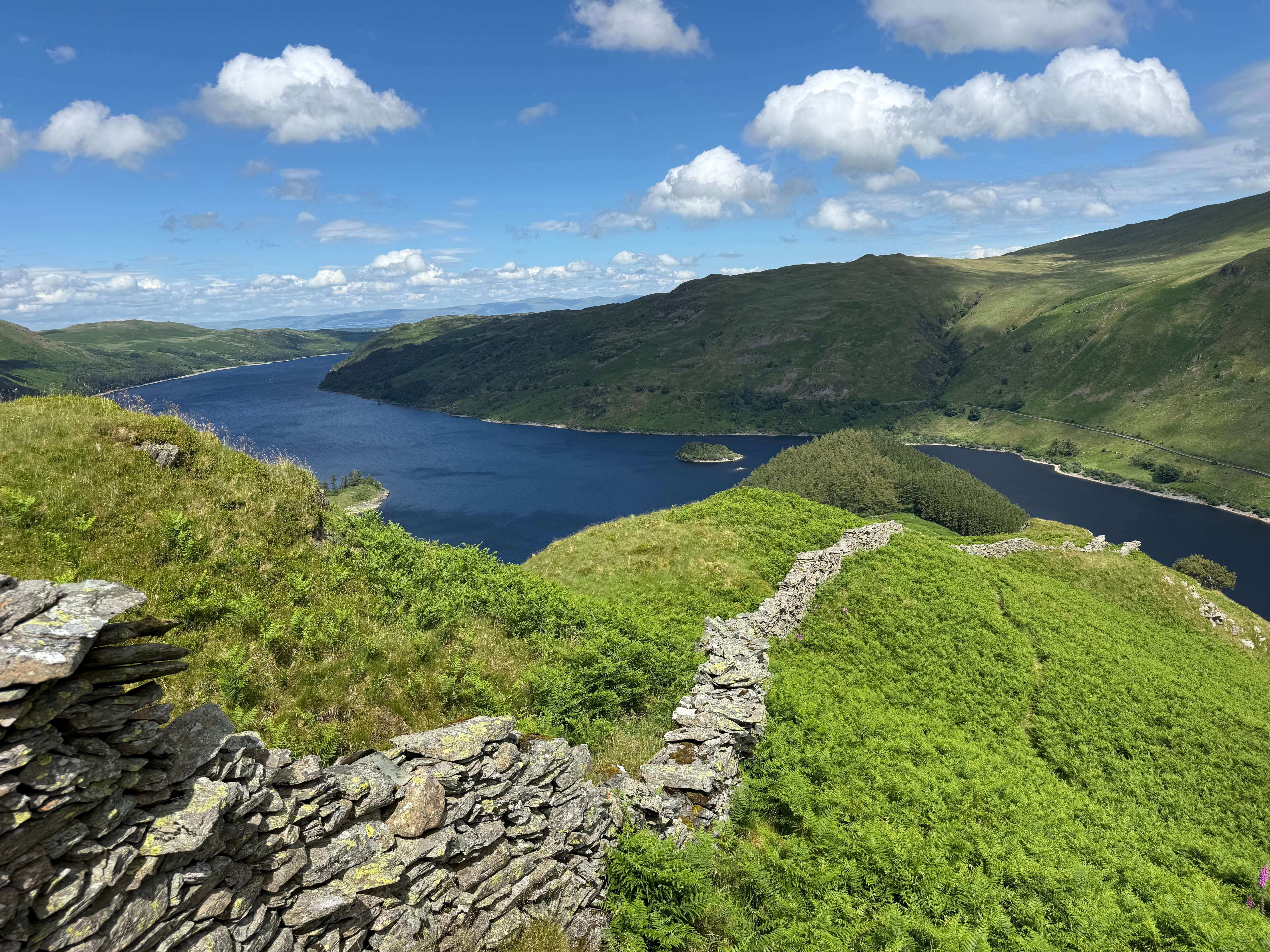 Dry-stone wall running along a ridge high above Haweswater reservoir
